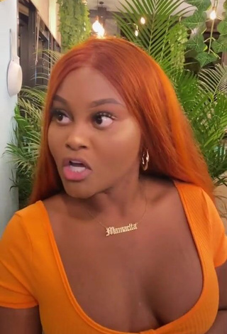 4. Sexy Lajesuu Shows Cleavage in Orange Dress