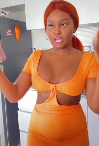 3. Hot Lajesuu Shows Cleavage in Orange Dress