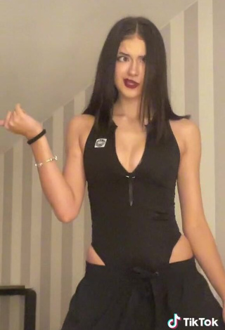 4. Hot Liza Nice Shows Cleavage in Black Bodysuit