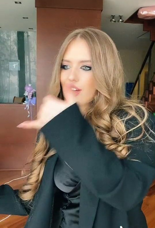 4. Hot Viktoria Nikulina Shows Cleavage in Black Dress