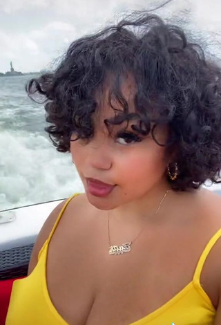 4. Desirable Phaith Montoya Shows Cleavage in Yellow Dress on a Boat