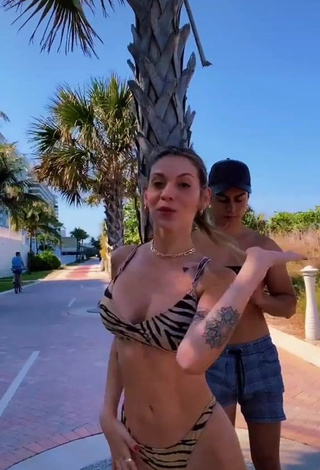 2. Magnetic Sasha Ferro Shows Cleavage in Appealing Zebra Bikini in a Street