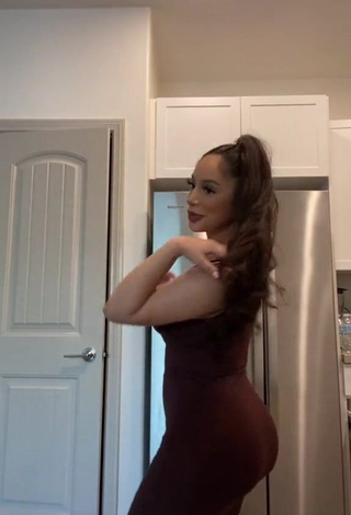 Hot Alondra Ortiz Shows Cleavage in Brown Dress