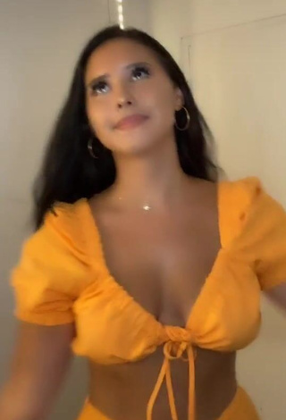 3. Pretty Anissa Shows Cleavage in Orange Crop Top