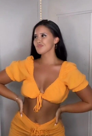 Cute Anissa Shows Cleavage in Orange Crop Top