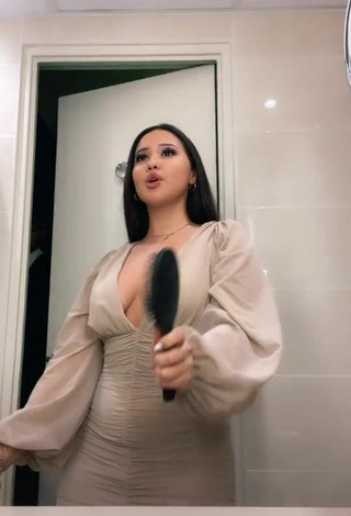 Desirable Anissa Shows Cleavage in Dress (Side Boob)