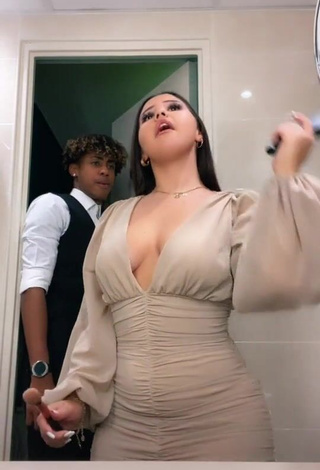 3. Desirable Anissa Shows Cleavage in Dress (Side Boob)