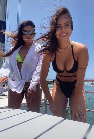 1. Beautiful Bianca Jesuino Shows Cleavage in Sexy Black Bikini on a Boat