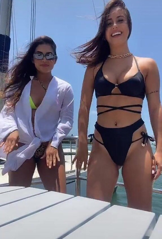 Beautiful Bianca Jesuino Shows Cleavage in Sexy Black Bikini on a Boat