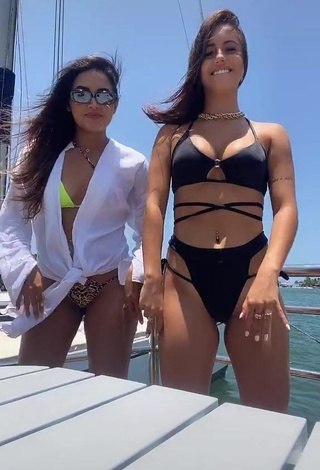 3. Beautiful Bianca Jesuino Shows Cleavage in Sexy Black Bikini on a Boat