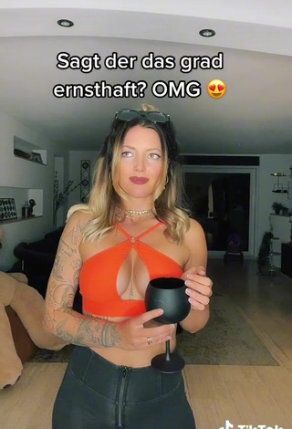 3. Sweetie Aline Jost Shows Cleavage in Orange Crop Top (Side Boob)