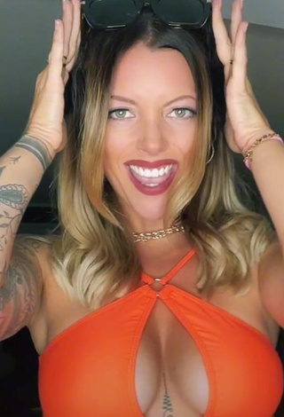 1. Hot Aline Jost Shows Cleavage in Orange Crop Top (Side Boob)