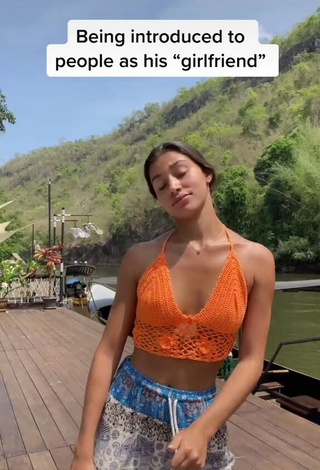 3. Sexy Kaory Desole Shows Cleavage in Orange Crop Top