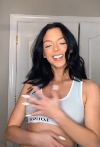 Hot Eliza Minor Shows Cleavage in Sport Bra