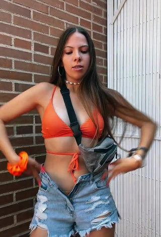 4. Hot Esther Martinez Shows Cleavage in Orange Bikini Top