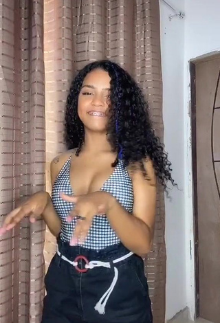 3. Sexy Radija Pereira Shows Cleavage in Checkered Top