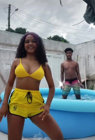 4. Hot Radija Pereira Shows Cleavage in Yellow Bikini Top