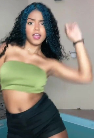 Sexy Radija Pereira Shows Cleavage in Olive Tube Top