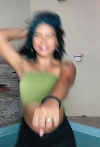 3. Sexy Radija Pereira Shows Cleavage in Olive Tube Top