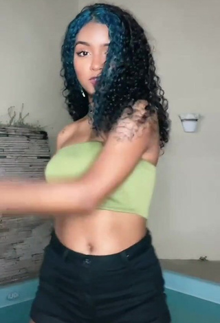 Hot Radija Pereira Shows Cleavage in Olive Tube Top