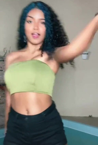 3. Hot Radija Pereira Shows Cleavage in Olive Tube Top