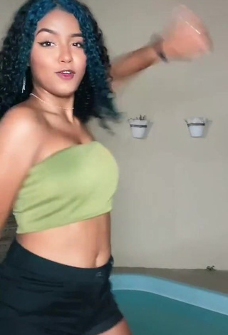 4. Hot Radija Pereira Shows Cleavage in Olive Tube Top