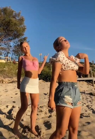 Amazing Caitlin Cummins in Hot Pink Crop Top at the Beach