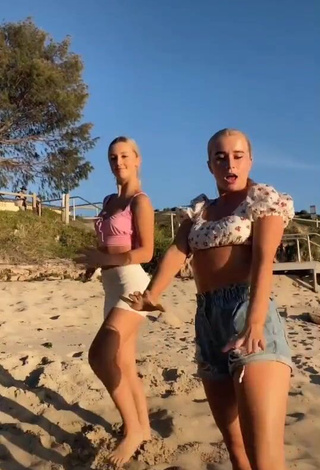 4. Amazing Caitlin Cummins in Hot Pink Crop Top at the Beach