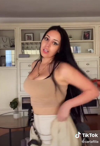 3. Sexy Carla Flila Shows Cleavage in Beige Top