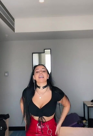 Seductive Carla Flila Shows Cleavage in Black Crop Top