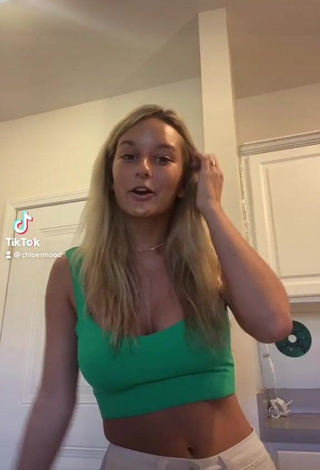 1. Sexy Chloe Hood Shows Cleavage in Green Crop Top