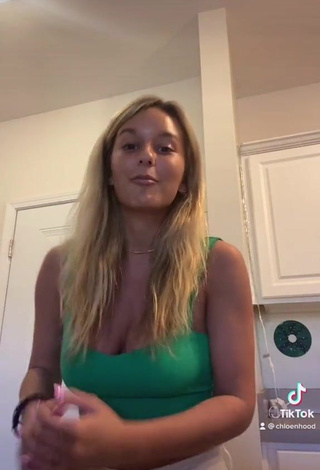 4. Sexy Chloe Hood Shows Cleavage in Green Crop Top