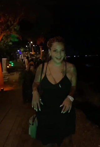 1. Hot ingizem34 Shows Cleavage in Black Dress in a Street