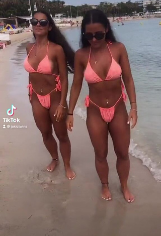 1. Cute jakictwins Shows Cleavage in Peach Bikini at the Beach