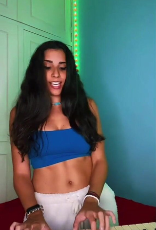 Desirable Ju Muniz Shows Cleavage in Blue Crop Top