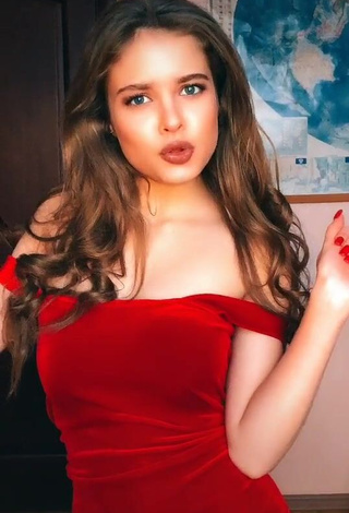 3. Hot Katrine Shows Cleavage in Red Dress