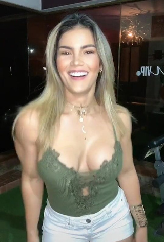 1. Hot Laura Fuentes Shows Cleavage in Olive Top (Side Boob)