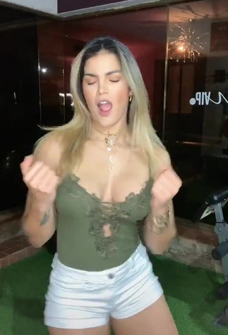 Hot Laura Fuentes Shows Cleavage in Olive Top (Side Boob)