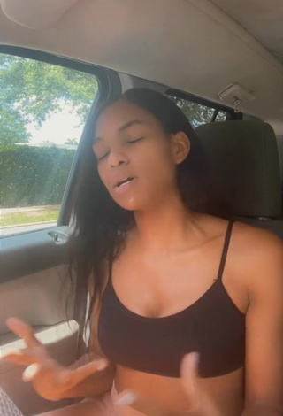 Hot Law Shows Cleavage in Black Crop Top in a Car