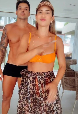 Adorable Lica Lopes Ramalho Shows Cleavage in Seductive Orange Bikini Top