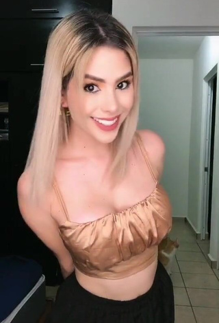 4. Dazzling Mafer Payan Shows Cleavage in Inviting Golden Crop Top