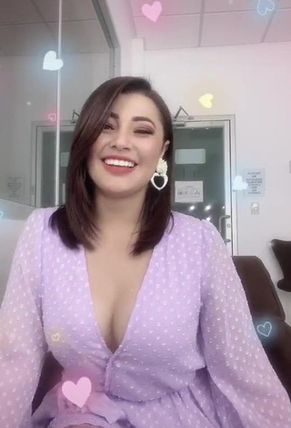 Sweet Milagro Flores Shows Cleavage in Cute Purple Dress