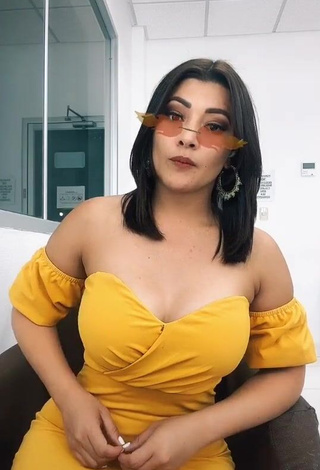 1. Sweetie Milagro Flores Shows Cleavage in Yellow Dress