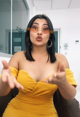 Sweetie Milagro Flores Shows Cleavage in Yellow Dress