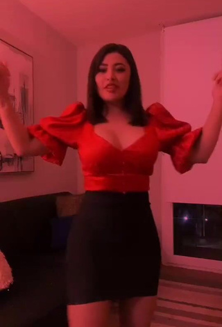 Beautiful Milagro Flores Shows Cleavage in Sexy Red Top