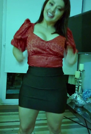 3. Hot Milagro Flores Shows Cleavage in Red Crop Top