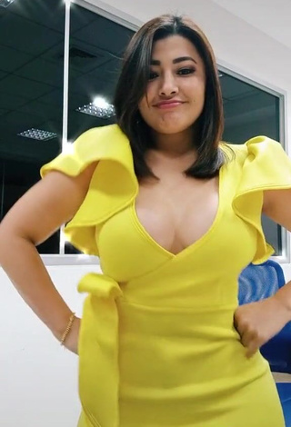 4. Cute Milagro Flores Shows Cleavage in Yellow Dress