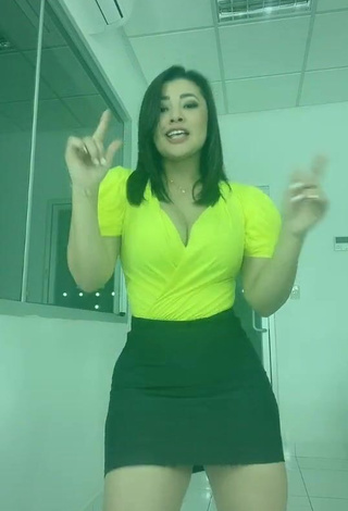 1. Hot Milagro Flores Shows Cleavage in Yellow Top