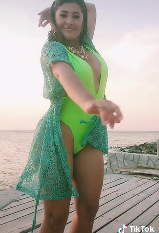 4. Sexy Milagro Flores Shows Cleavage in Green Swimsuit