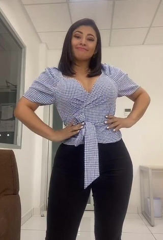 1. Desirable Milagro Flores Shows Cleavage in Checkered Crop Top